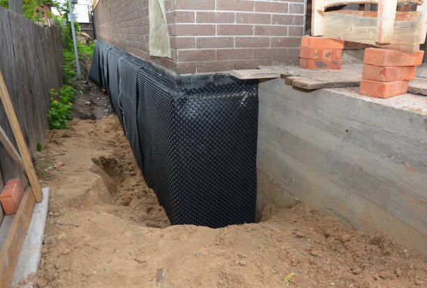 Happy homeowners after waterproofing job in Cygnet